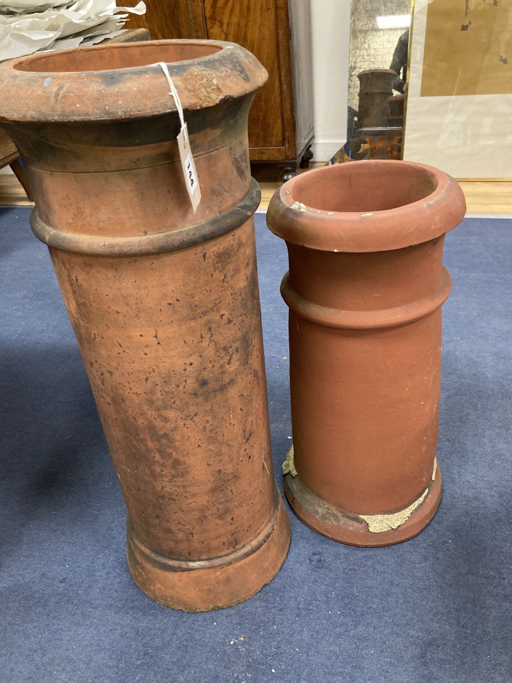 Two terracotta chimney pots, tallest 77cm